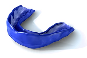 Close-up of a blue athletic mouthguard on white background