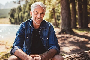 smiling man with dental bridge in Rockville  