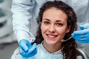 young woman smiling in the dental chair