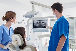 dentist showing patient their dental x-rays