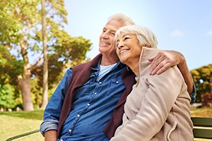 couple sitting on a park bench