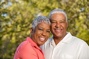 happy couple smiling while outside