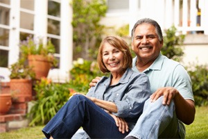 happy couple sitting outside