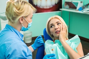 Woman getting emergency dental exam