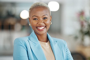 Smiling businesswoman with a light blue jacket