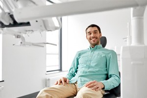 Male dental patient sitting in a dental chair
