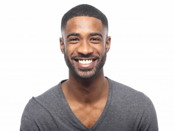 patient smiling after getting dental implant surgery