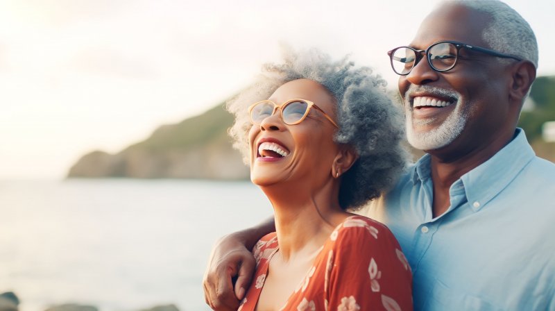 Couple laughs by lake