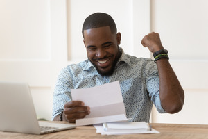 Man celebrating a refund on his taxes